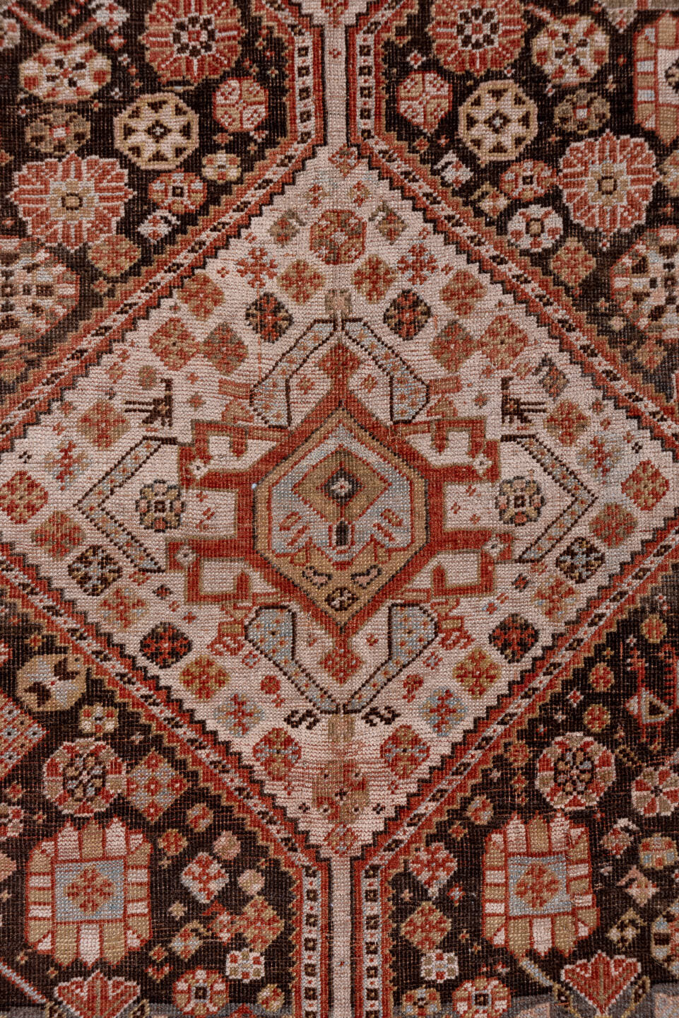 5' x 10' one-of-a-kind handmade antique Qashqai medium size rug. Color palette: ivory, charcoal, rust, slate, taupe, camel