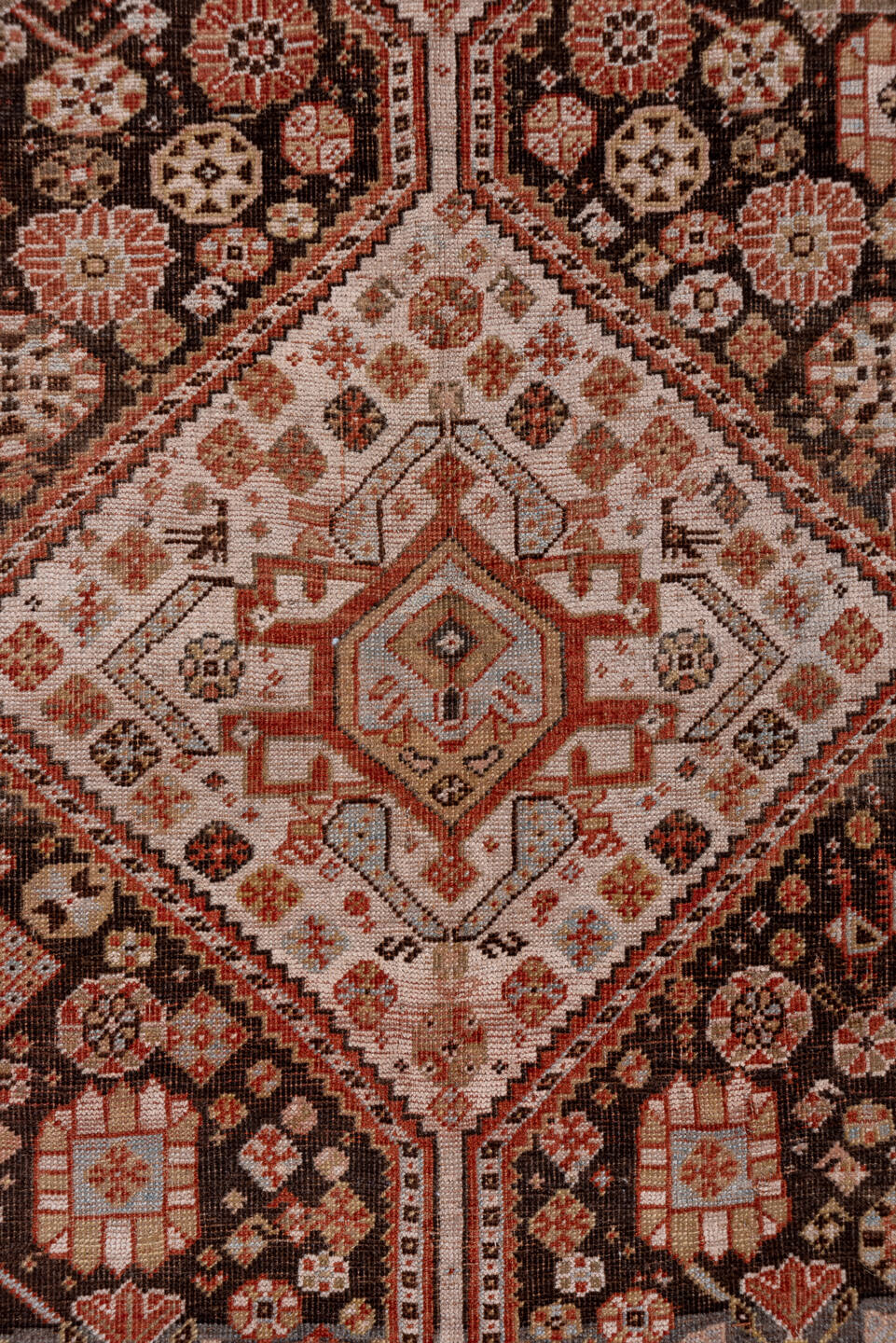 5' x 10' one-of-a-kind handmade antique Qashqai medium size rug. Color palette: ivory, charcoal, rust, slate, taupe, camel