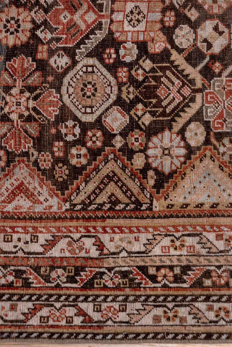 5' x 10' one-of-a-kind handmade antique Qashqai medium size rug. Color palette: ivory, charcoal, rust, slate, taupe, camel