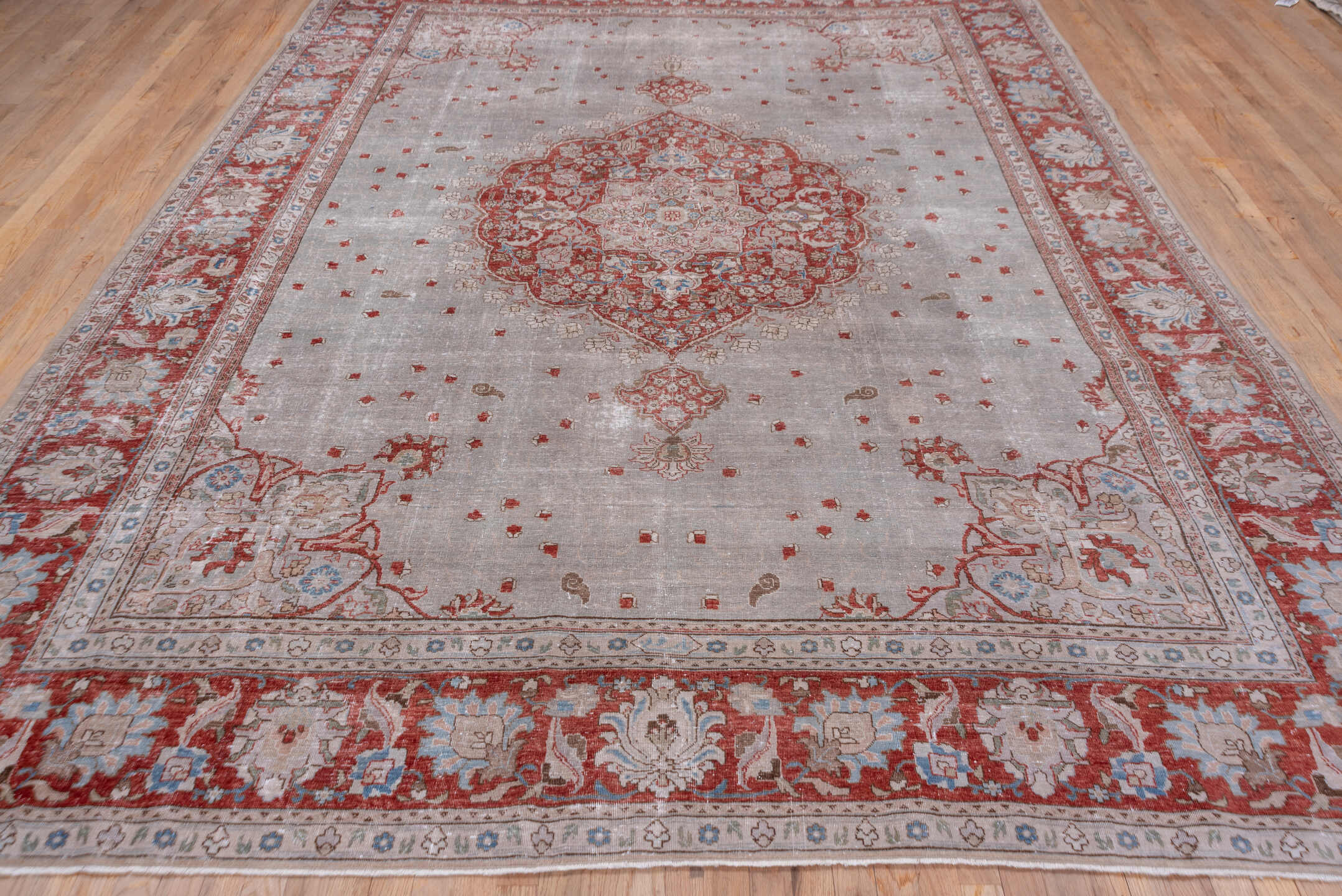 9' x 12' one-of-a-kind handmade antique Tabriz large size rug. Color palette: ivory, rust, taupe, sky blue, rose, beige