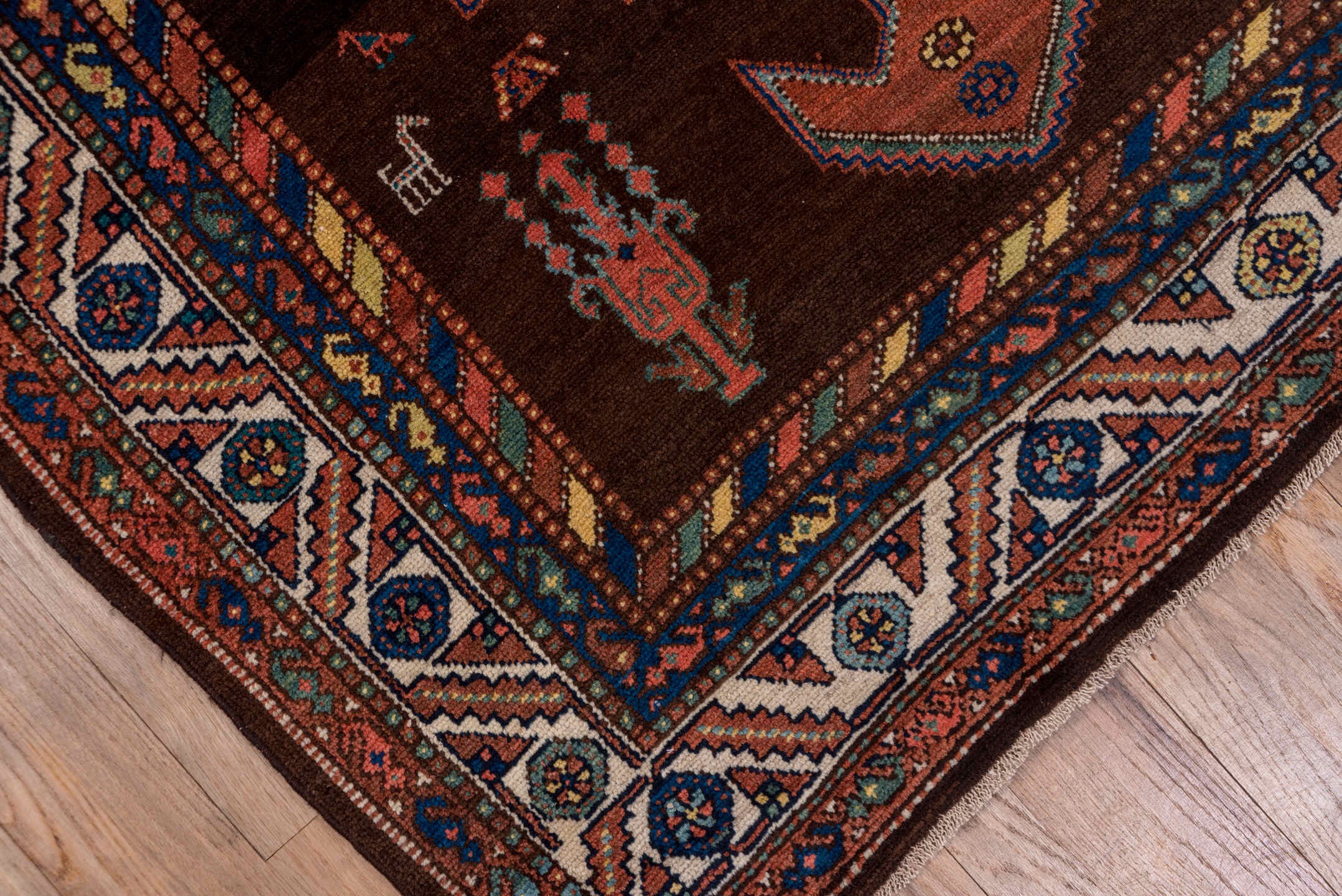 4' x 11' one-of-a-kind handmade antique Malayer runner rug. Color palette: brown, rust, ivory, navy, terra cotta, indigo