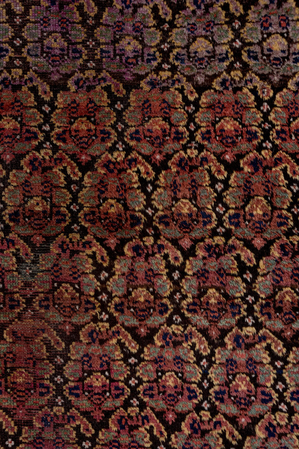 4' x 9' one-of-a-kind handmade antique Kurd rug. Color palette: rust, navy, brown, rose, ivory, gold, sage, terracotta, blue