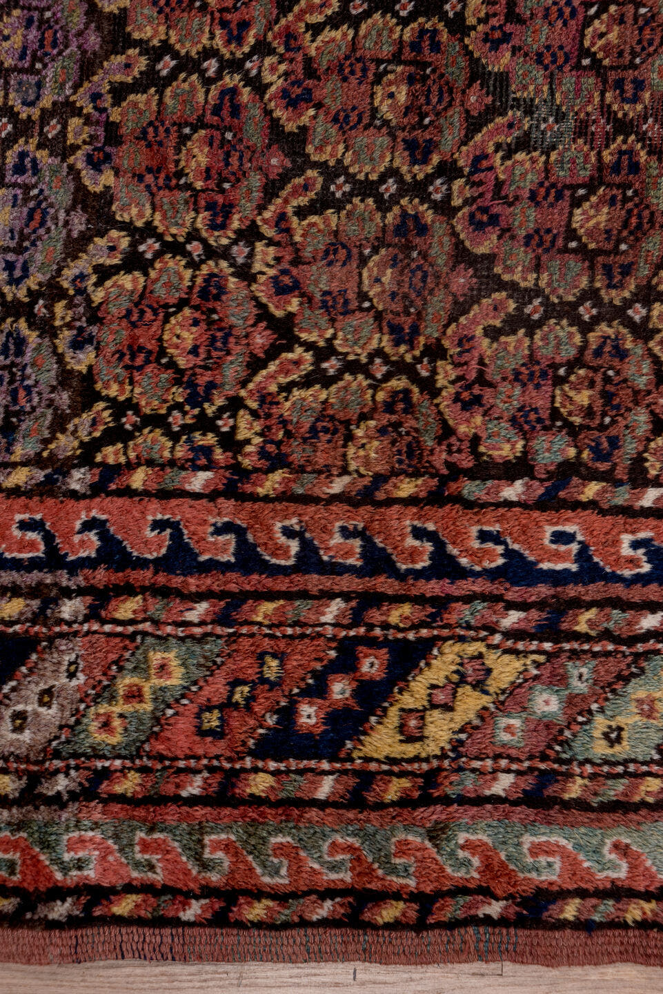 4' x 9' one-of-a-kind handmade antique Kurd rug. Color palette: rust, navy, brown, rose, ivory, gold, sage, terracotta, blue