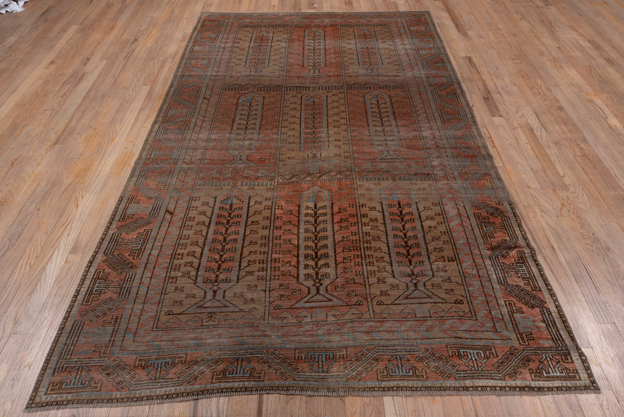 5' x 9' one-of-a-kind handmade antique Belouch large size rug. Color palette: rust, brown, slate, taupe, charcoal