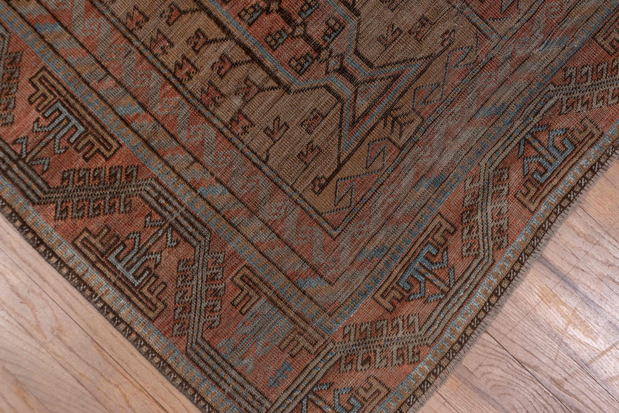 5' x 9' one-of-a-kind handmade antique Belouch large size rug. Color palette: rust, brown, slate, taupe, charcoal