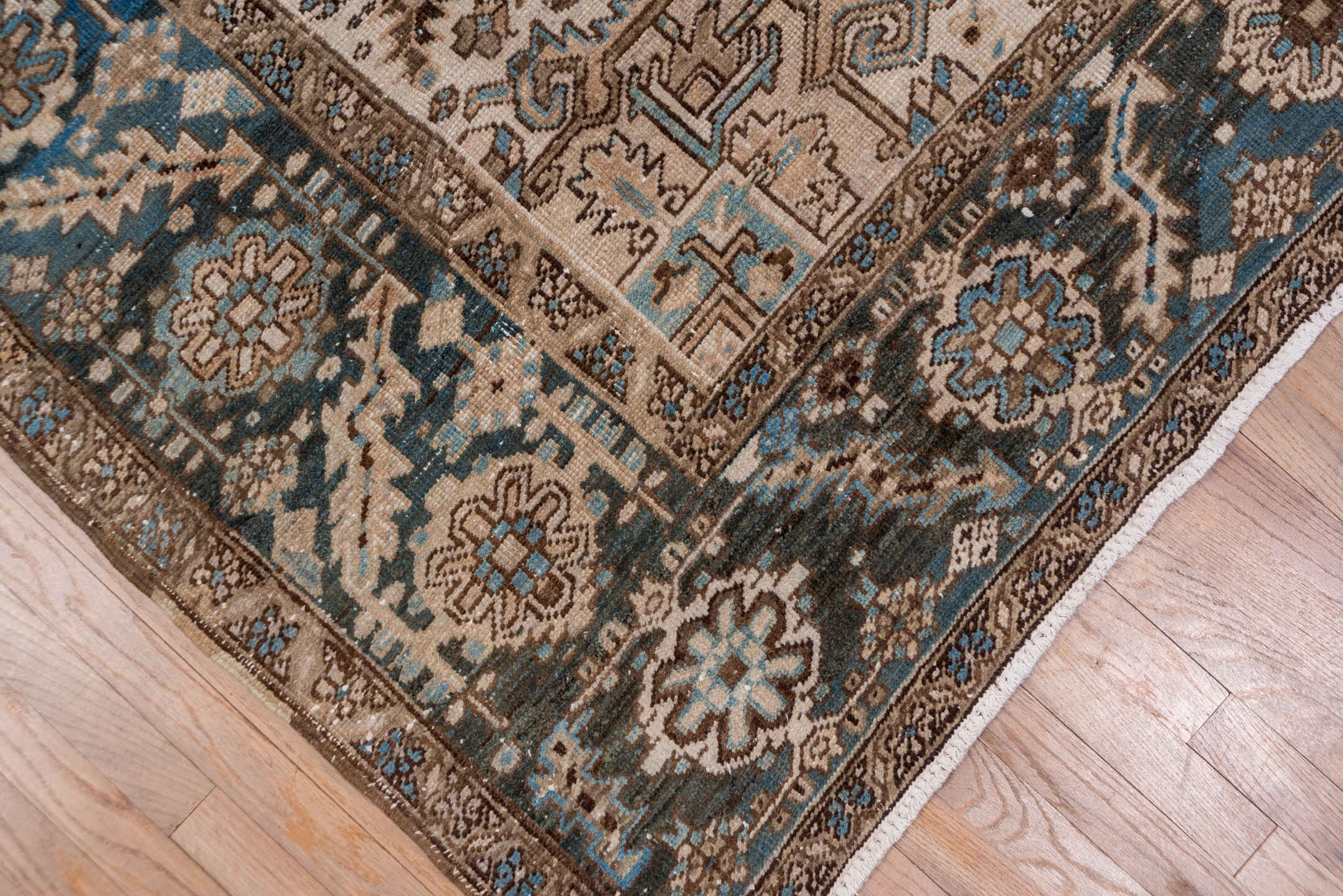 6' x 9' one-of-a-kind handmade antique Heriz medium size rug. Color palette: ivory, blue, taupe, brown, sky blue, charcoal