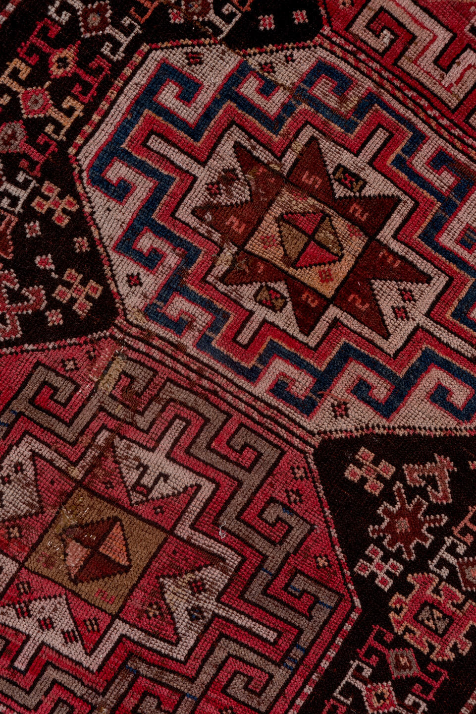4' x 9' one-of-a-kind handmade antique Kazak runner rug. Color palette: rust, ivory, burgundy, charcoal, rose, taupe