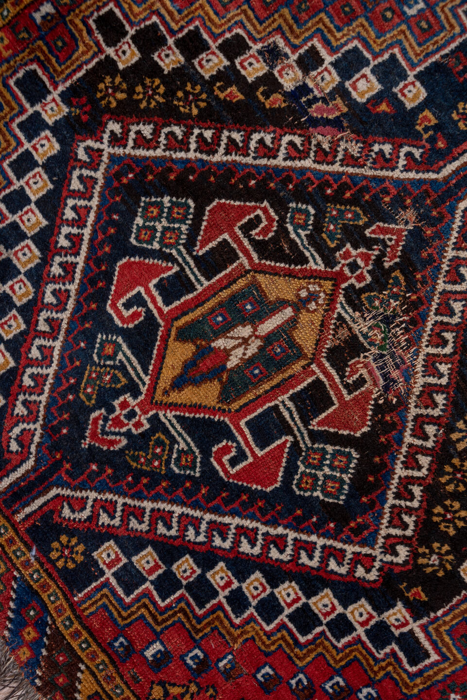 3' x 9' one-of-a-kind handmade vintage Shiraz runner rug. Color palette: black, blue, brown, fiord, gray, pink, red