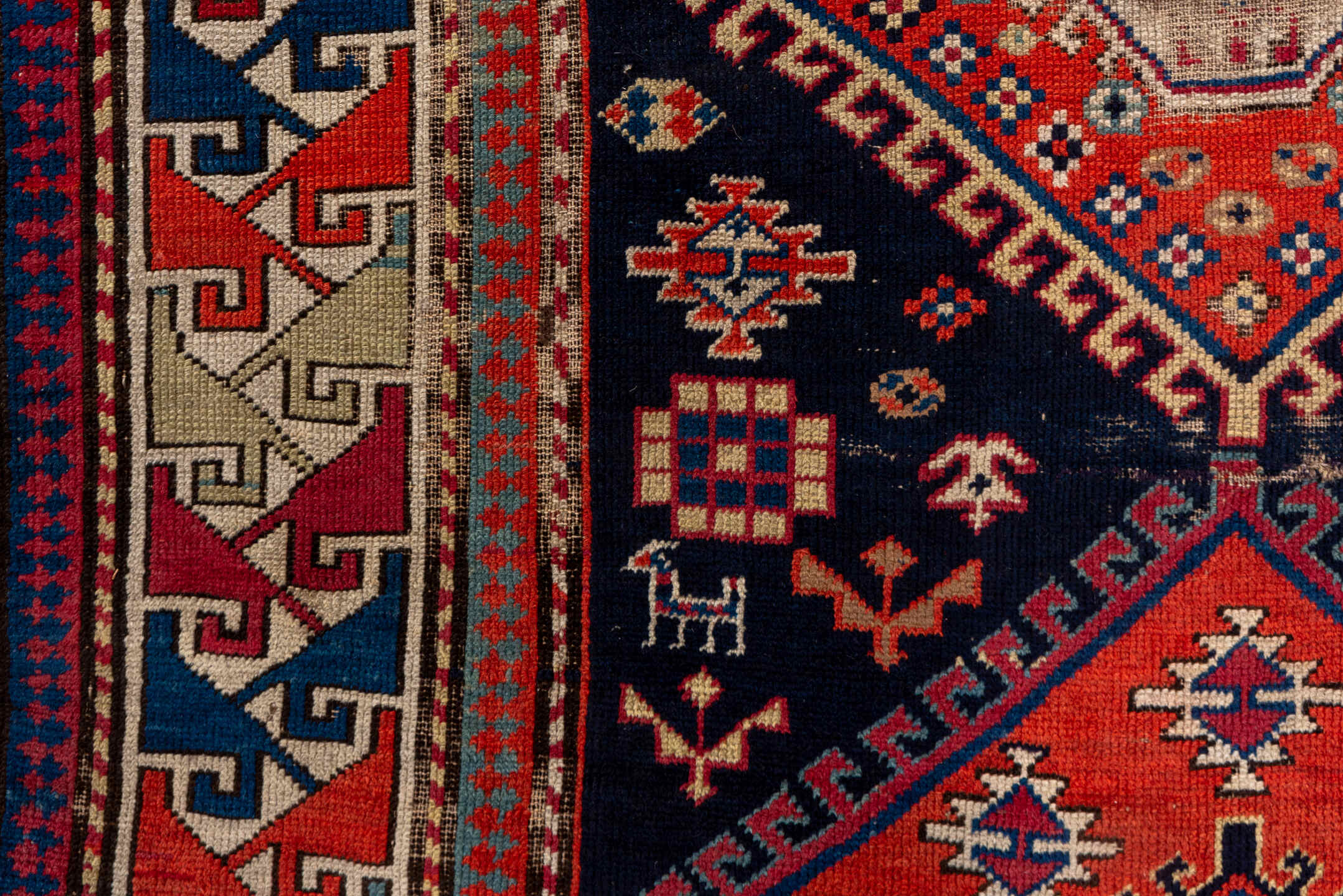 4' x 9' one-of-a-kind handmade vintage Shirvan runner rug. Color palette: navy, rust, ivory, sky blue, camel, red, slate