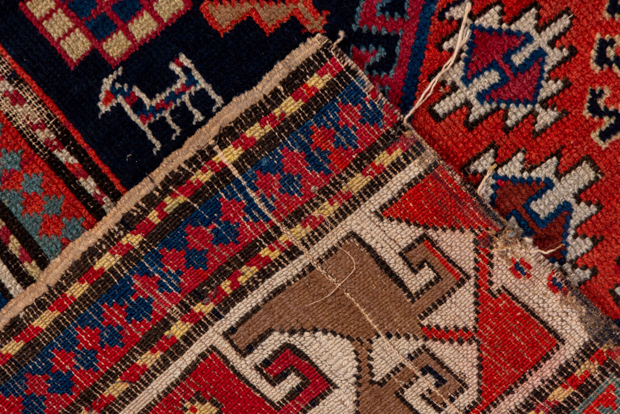 4' x 9' one-of-a-kind handmade vintage Shirvan runner rug. Color palette: navy, rust, ivory, sky blue, camel, red, slate