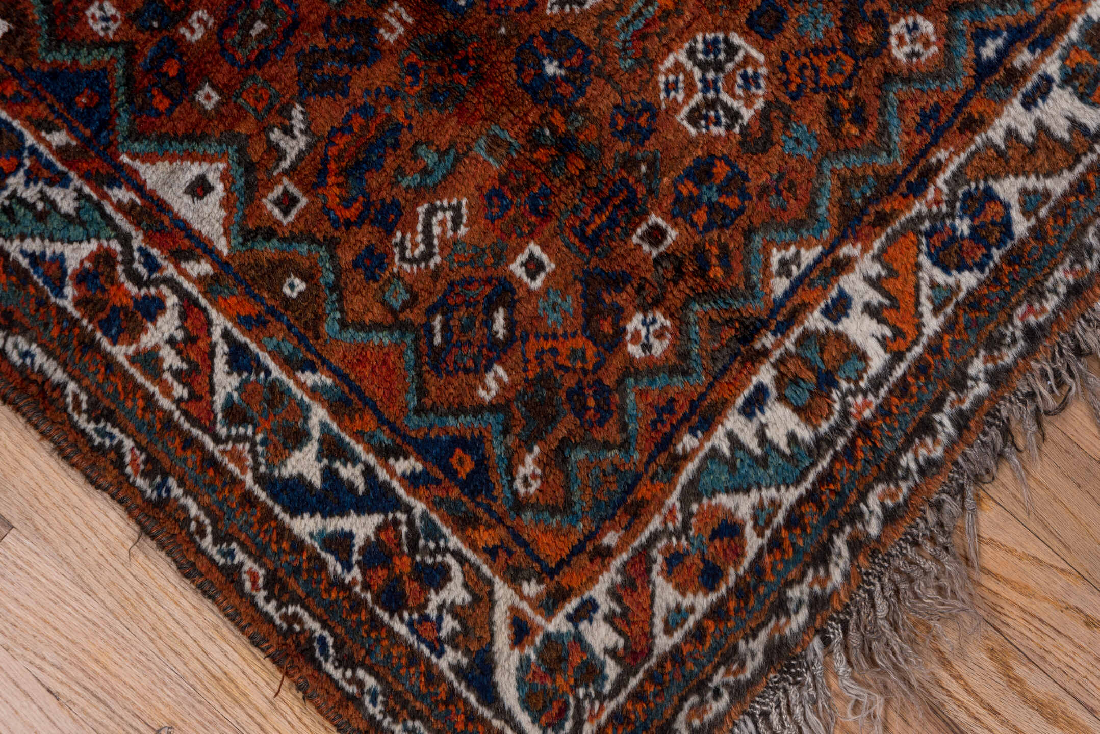 2' x 4' one-of-a-kind handmade antique Shiraz small size rug. Color palette: rust, indigo, ivory, terra cotta, teal