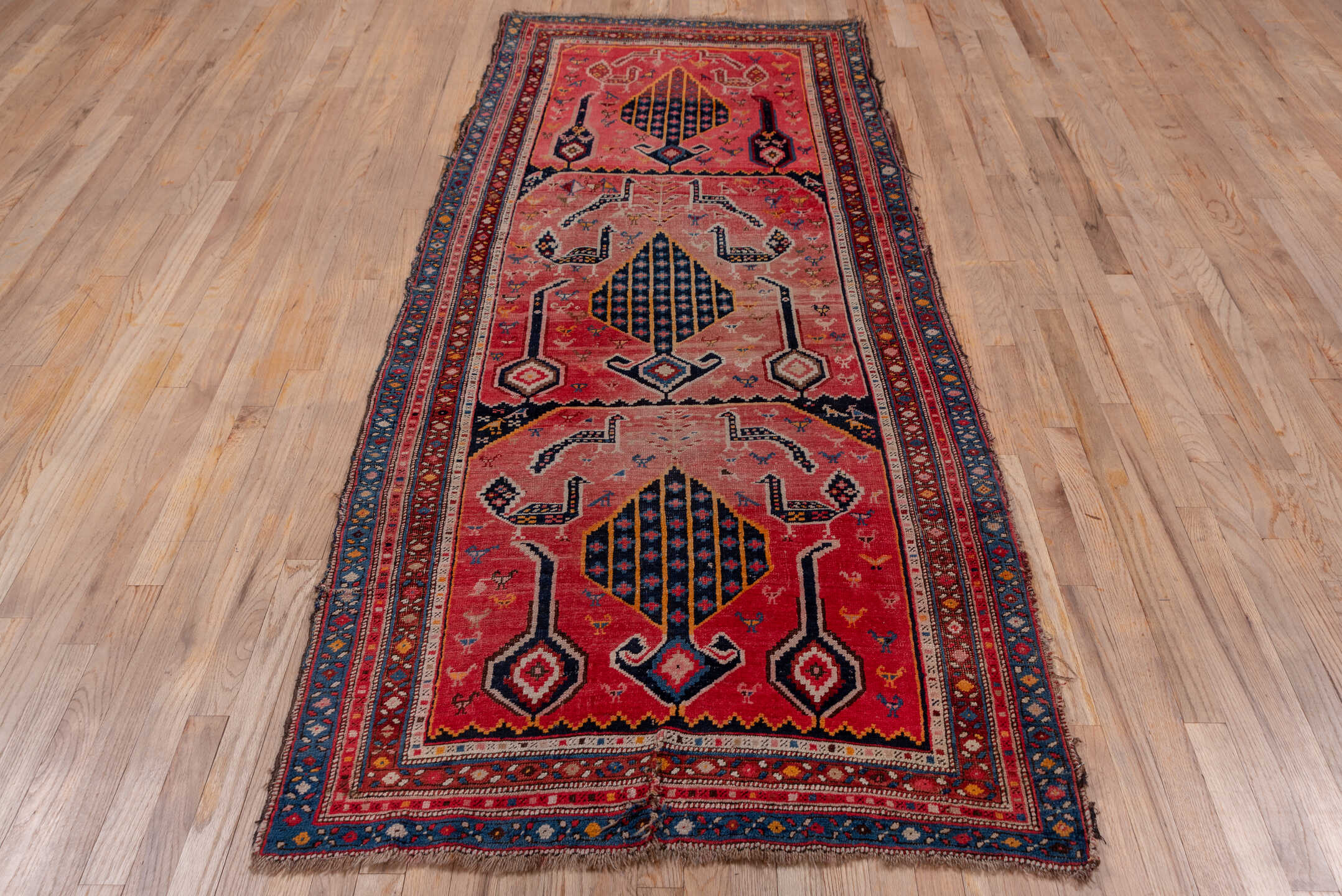3' x 8' one-of-a-kind handmade antique Karabagh runner rug. Color palette: rose, indigo, crimson, ivory, navy, gold, coral