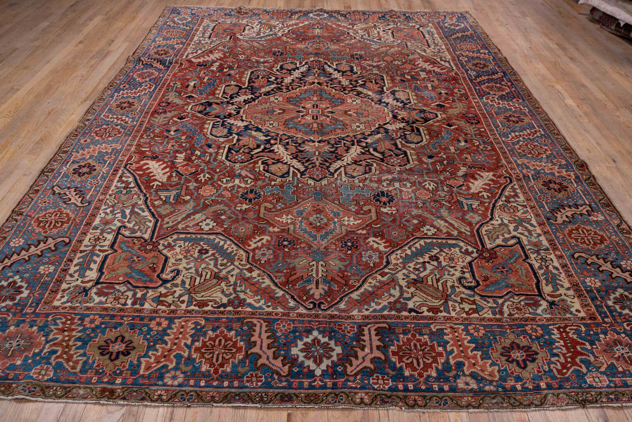 8' x 12' one-of-a-kind handmade antique Heriz large size rug. Color palette: rust, blue, ivory, navy, terra cotta, slate