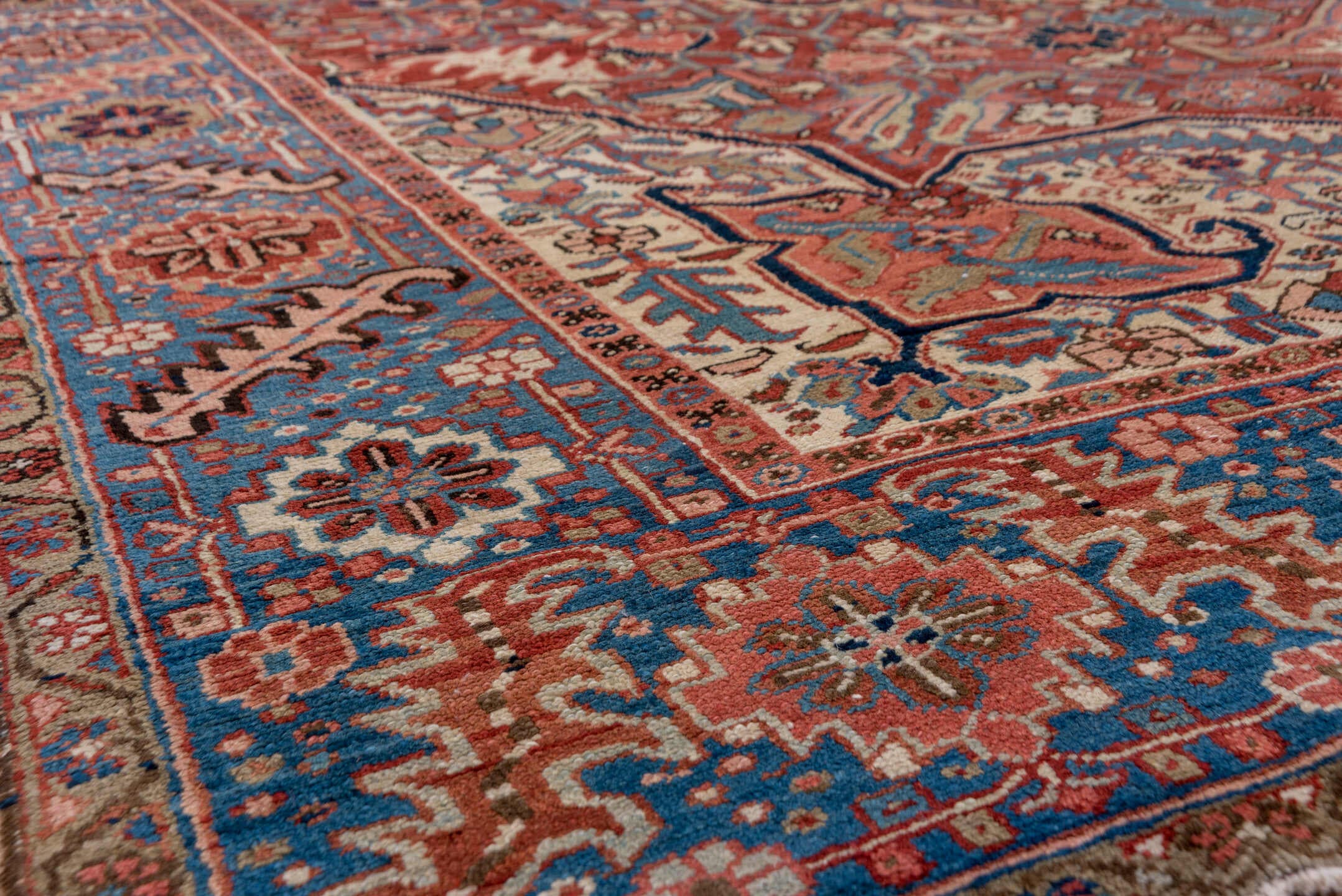 8' x 12' one-of-a-kind handmade antique Heriz large size rug. Color palette: rust, blue, ivory, navy, terra cotta, slate