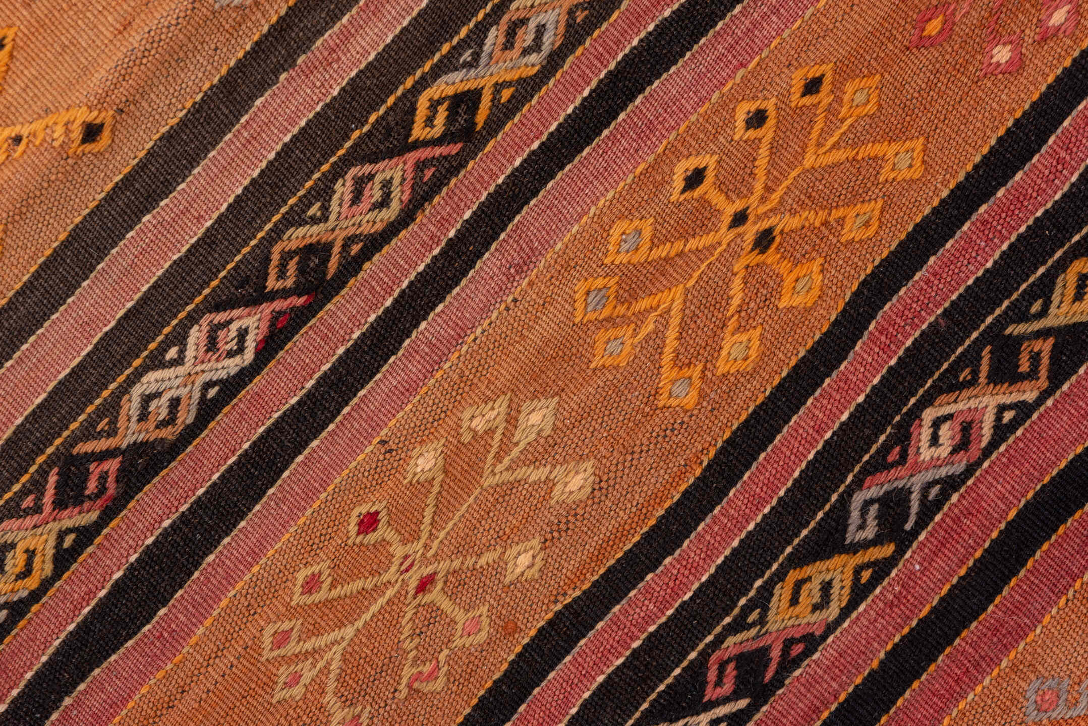 2' x 8' one-of-a-kind handmade vintage Kilim runner rug. Color palette: terra cotta, rust, charcoal, ivory, gold, rose