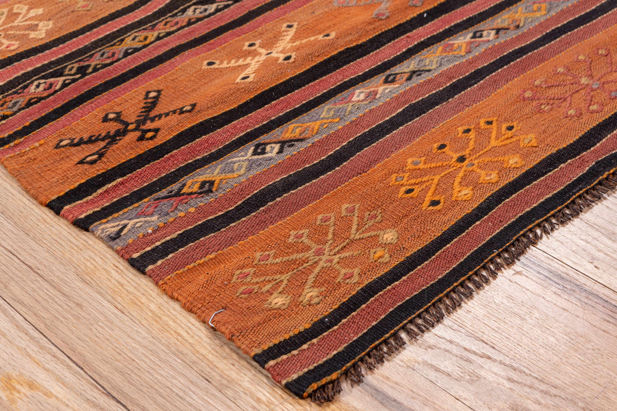 2' x 8' one-of-a-kind handmade vintage Kilim runner rug. Color palette: terra cotta, rust, charcoal, ivory, gold, rose