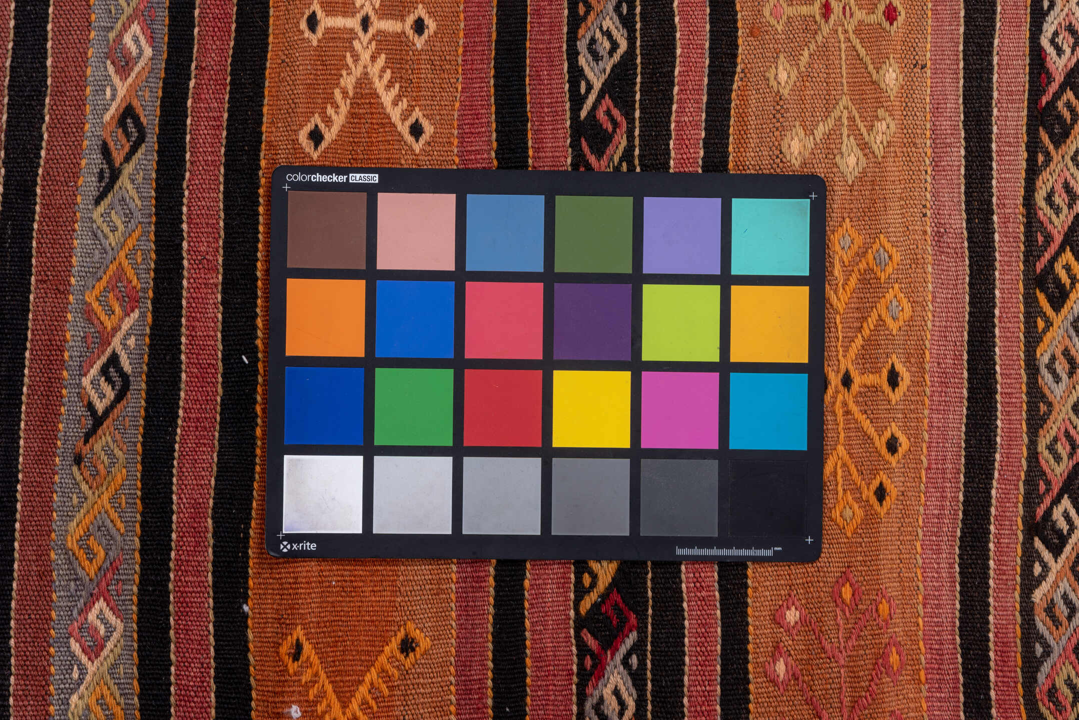 2' x 8' one-of-a-kind handmade vintage Kilim runner rug. Color palette: terra cotta, rust, charcoal, ivory, gold, rose