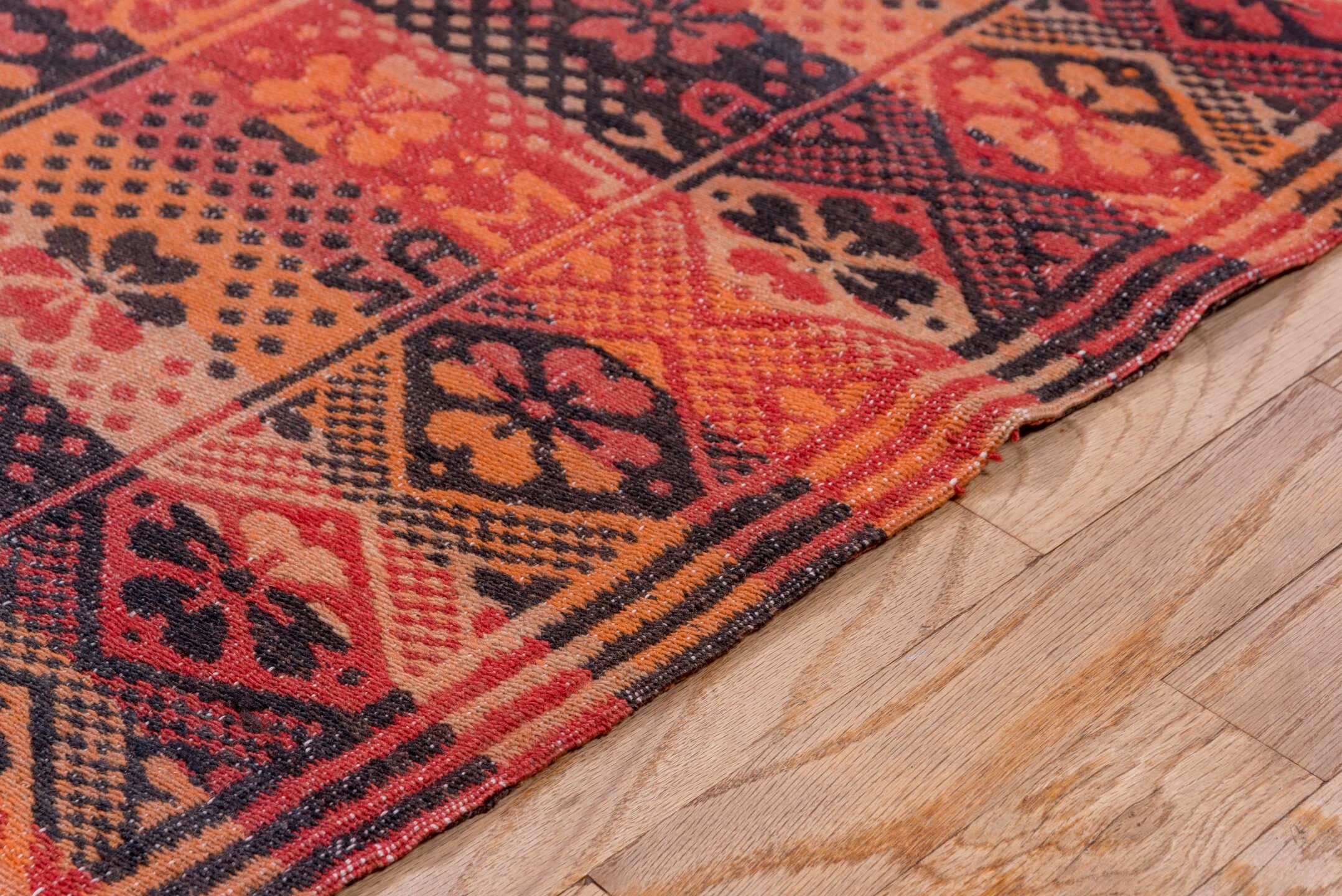 5' x 11' one-of-a-kind handmade antique Kilim rug. Color palette: terra cotta, rust, coral, mahogany, burgundy, rose