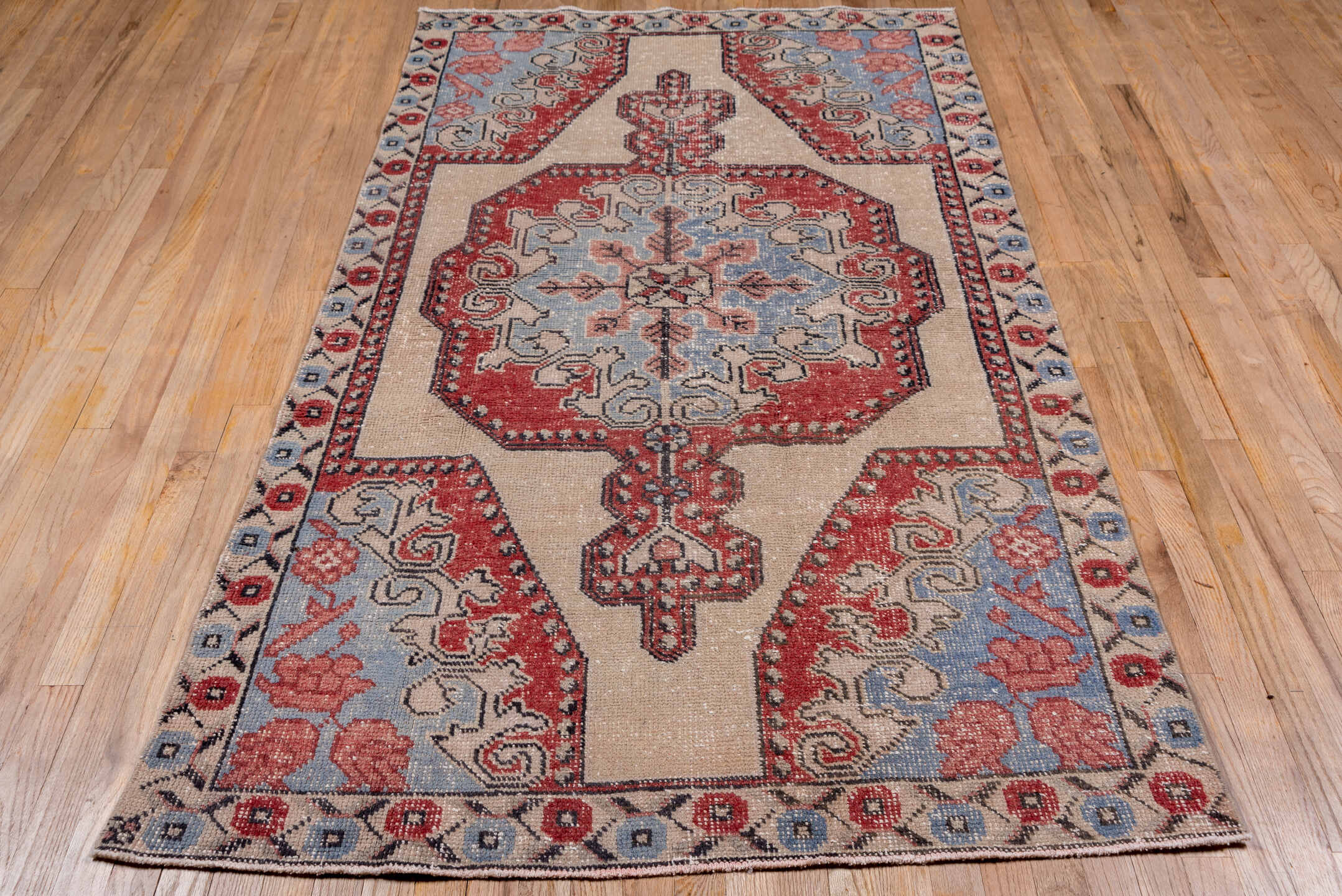 4' x 7' one-of-a-kind handmade vintage Oushak rug. Color palette: black, blue, brown, gray, light gray, off-white, pink, red