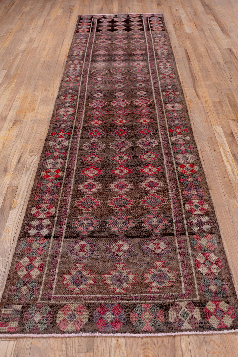 3' x 12' one-of-a-kind handmade vintage Kars runner rug. Color palette: brown, gray, light gray, pink, red