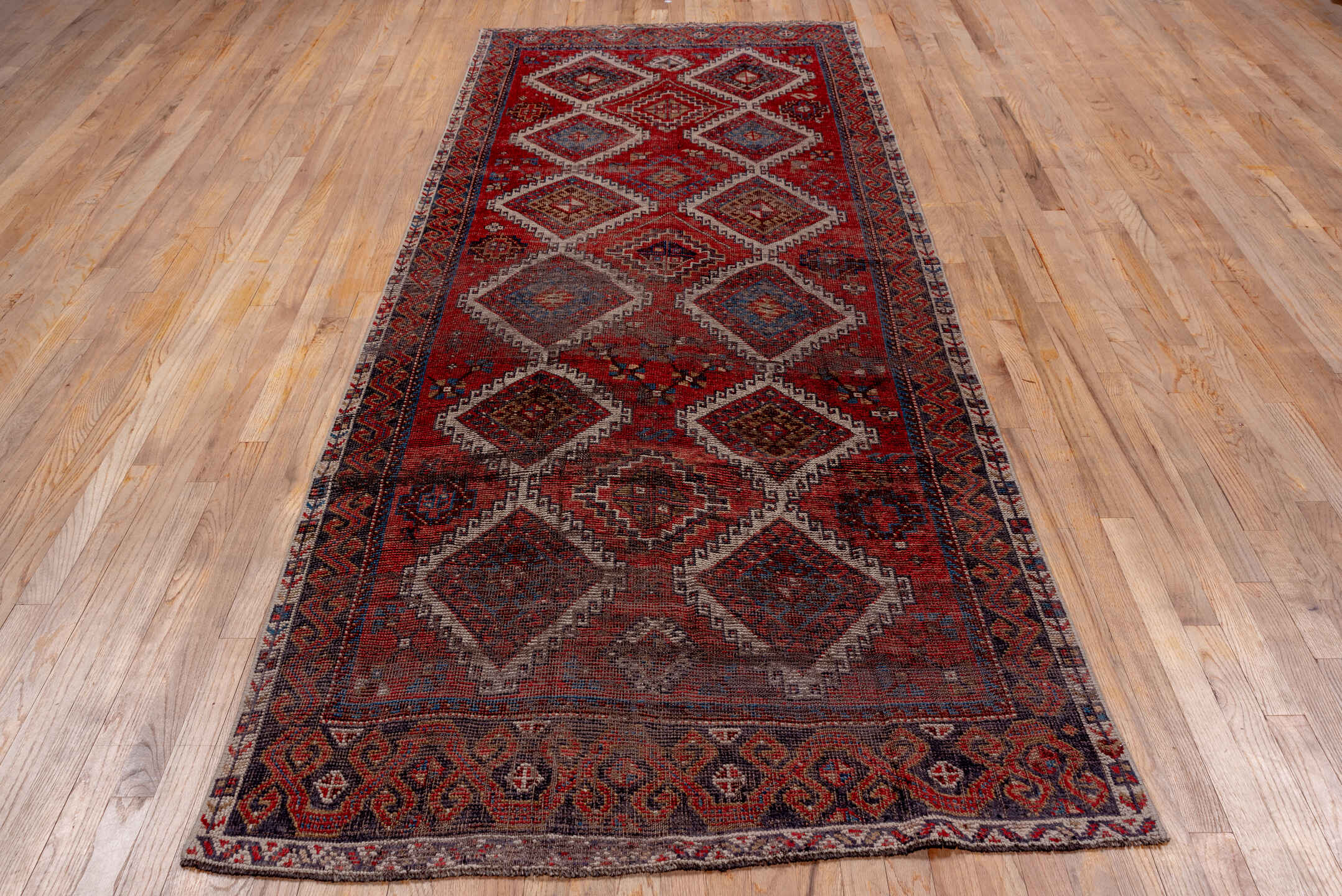 4' x 10' one-of-a-kind handmade vintage Oushak runner rug. Color palette: brown, gray, light gray, pink, red, wine