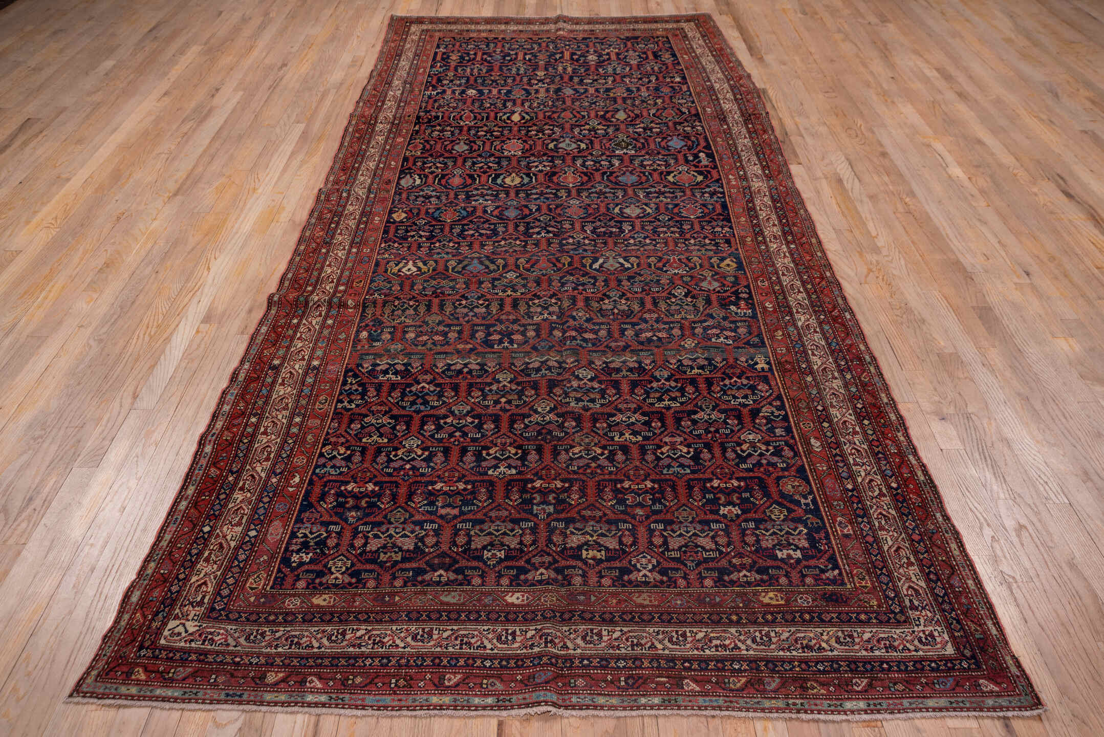 5' x 12' one-of-a-kind handmade antique Malayer rug. Color palette: navy, rust, ivory, crimson, slate, camel, blue
