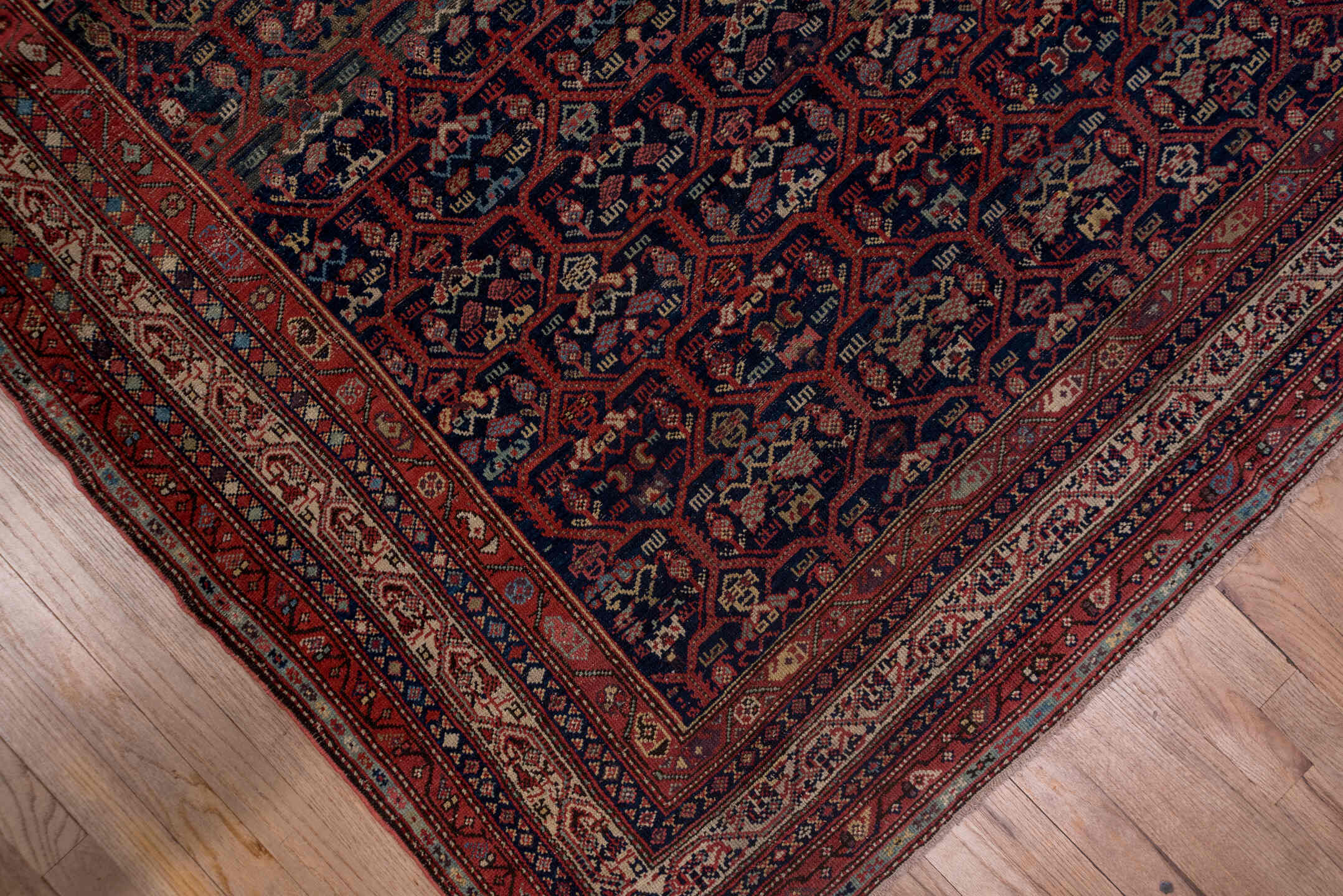 5' x 12' one-of-a-kind handmade antique Malayer rug. Color palette: navy, rust, ivory, crimson, slate, camel, blue