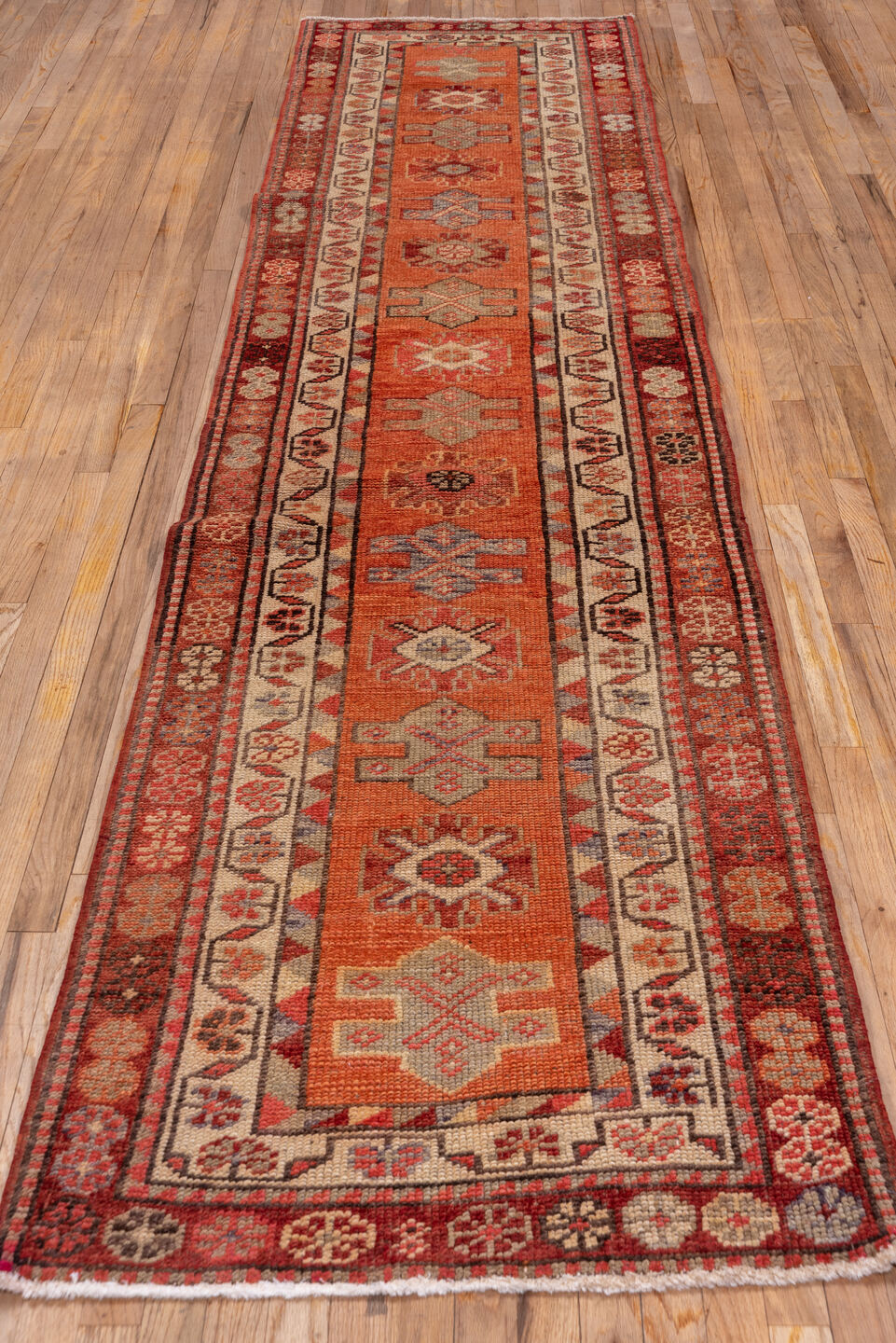 2' x 12' one-of-a-kind handmade vintage Oushak runner rug. Color palette: brown, pink, red, redwood
