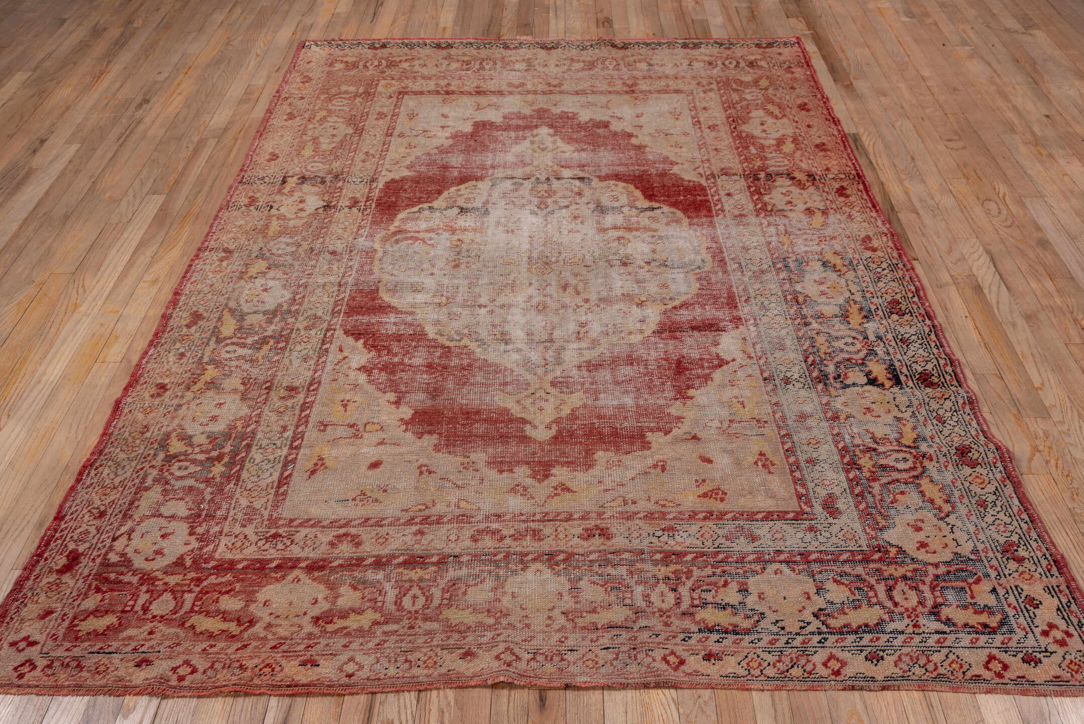 5' x 9' one-of-a-kind handmade vintage Oushak medium size rug. Color palette: brown, gray, light gray, pink, red, redwood