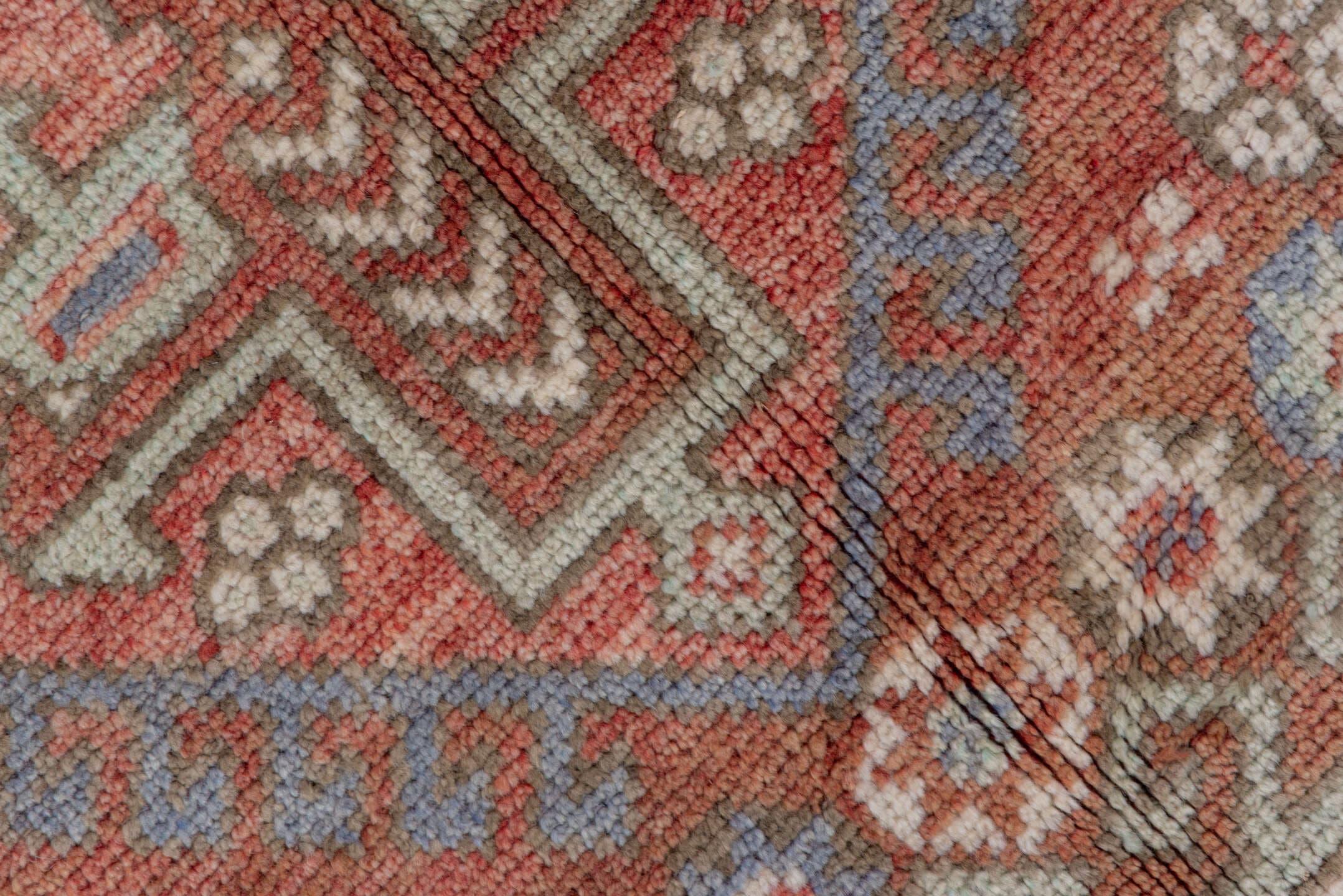 5' x 8' one-of-a-kind handmade vintage Oushak medium size rug. Color palette: terra cotta, ivory, dusty blue, rust, taupe