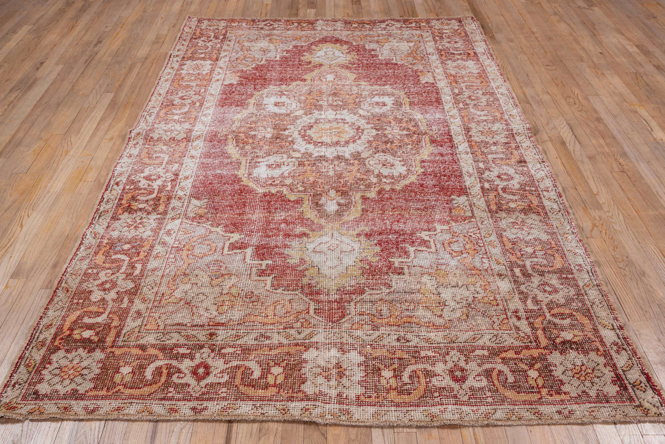 6' x 9' one-of-a-kind handmade vintage Oushak medium size rug. Color palette: terra cotta, ivory, rose, gold, rust, beige