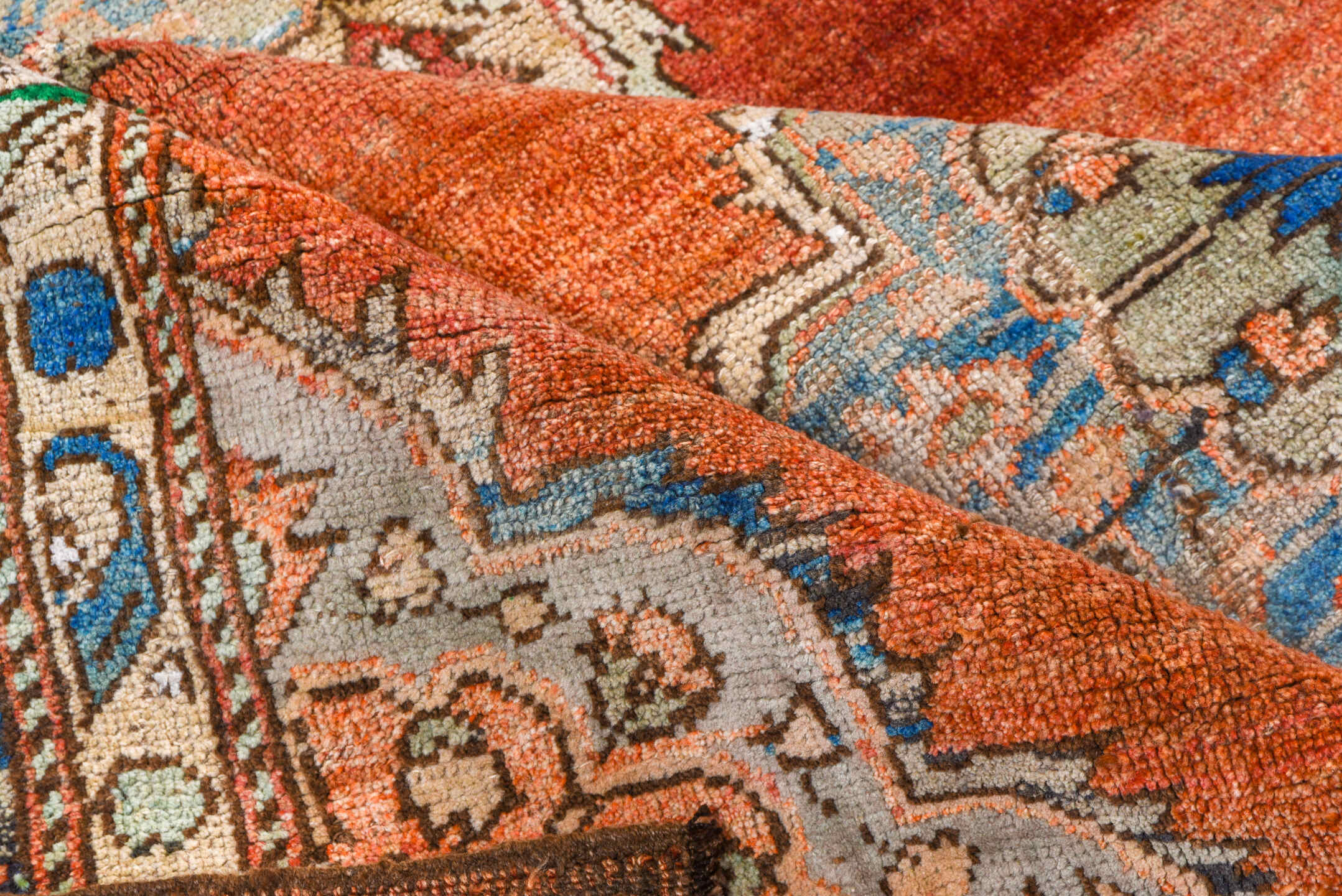 7' x 8' one-of-a-kind handmade vintage Oushak rug. Color palette: terra cotta, ivory, blue, sky blue, gray, rust, green