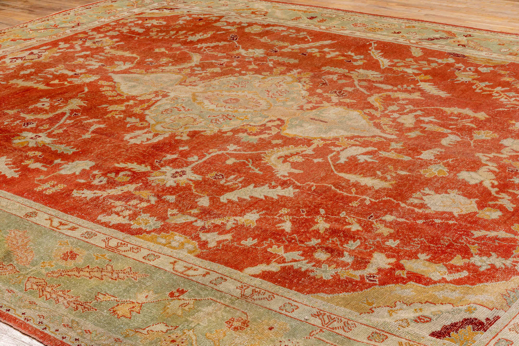 13' x 15' one-of-a-kind handmade antique Oushak oversize rug. Color palette: rust, ivory, sage, gold, terra cotta, beige