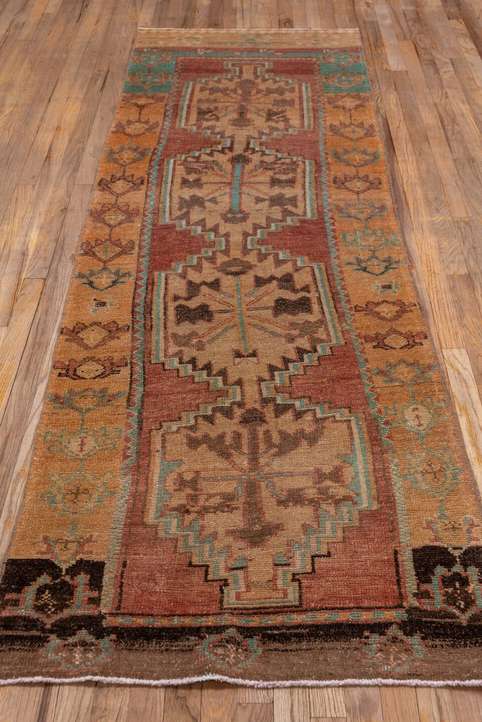 2' x 10' one-of-a-kind handmade vintage Oushak runner rug. Color palette: terra cotta, camel, tan, turquoise, brown, ivory