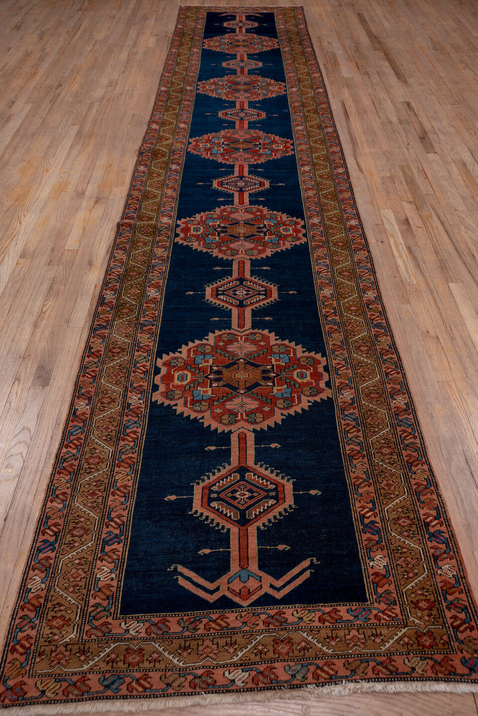 3' x 17' one-of-a-kind handmade antique Serapi runner rug. Color palette: navy, rust, camel, ivory, terra cotta, sage
