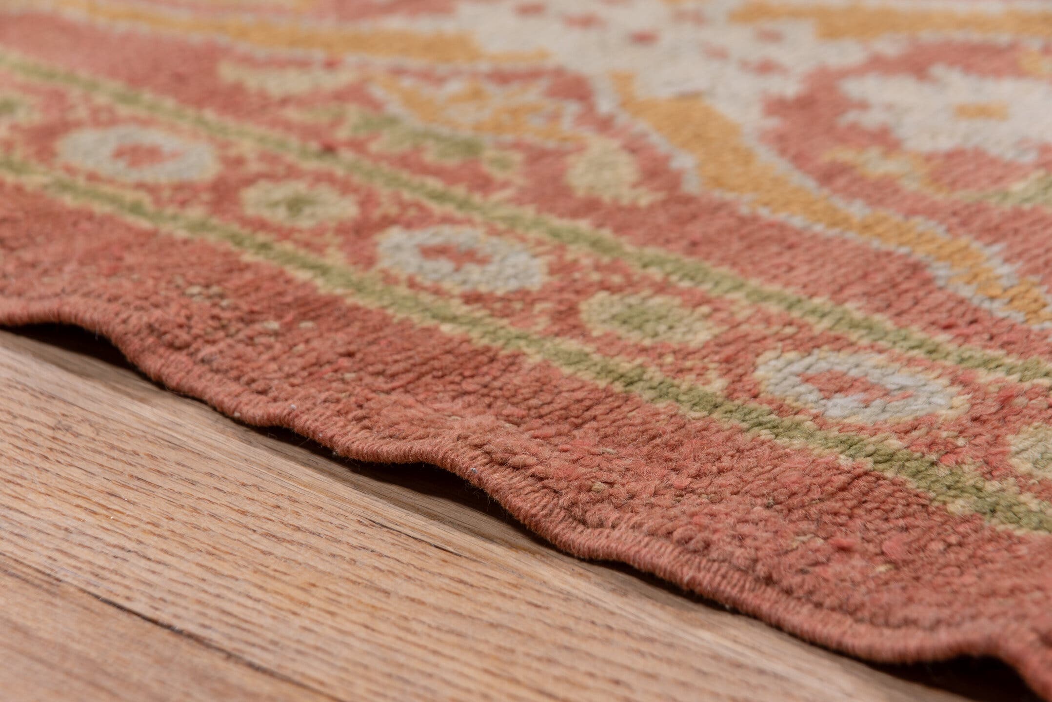10' x 20' one-of-a-kind handmade antique Spanish rug. Color palette: coral, ivory, gold, sage, terra cotta, terracotta
