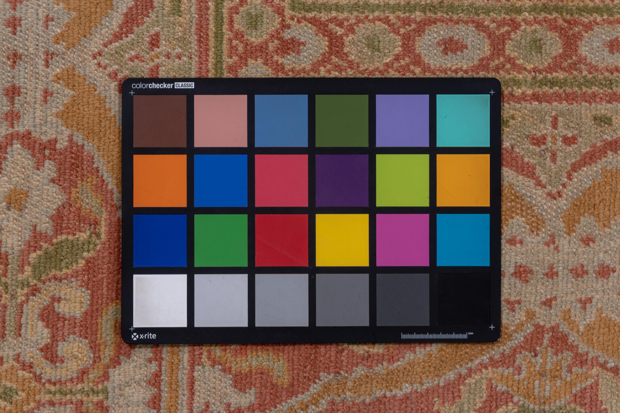 10' x 20' one-of-a-kind handmade antique Spanish rug. Color palette: coral, ivory, gold, sage, terra cotta, terracotta