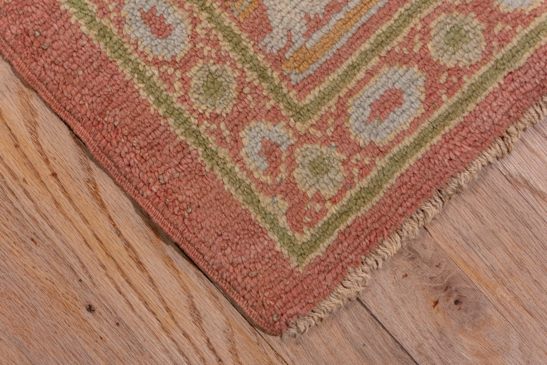 10' x 20' one-of-a-kind handmade antique Spanish rug. Color palette: coral, ivory, gold, sage, terra cotta, terracotta