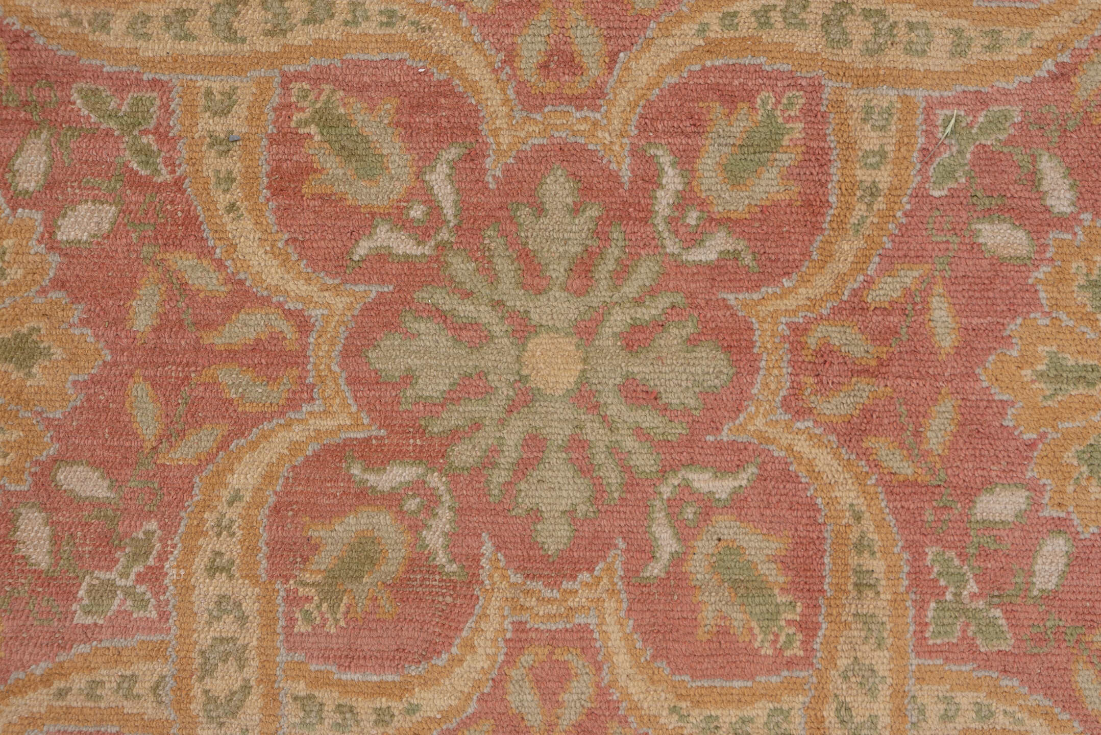 10' x 20' one-of-a-kind handmade antique Spanish rug. Color palette: coral, ivory, gold, sage, terra cotta, terracotta