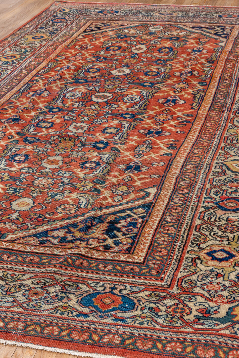 6' x 10' one-of-a-kind handmade antique Mahal large size rug. Color palette: terra cotta, ivory, navy, rust, camel, gold