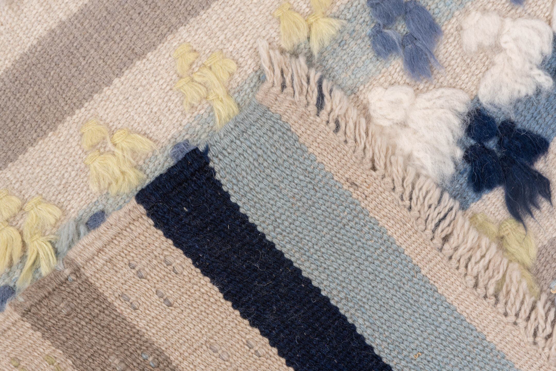 3' x 6' one-of-a-kind handmade vintage Tulu small size rug. Color palette: ivory, pale blue, taupe, navy, butter yellow