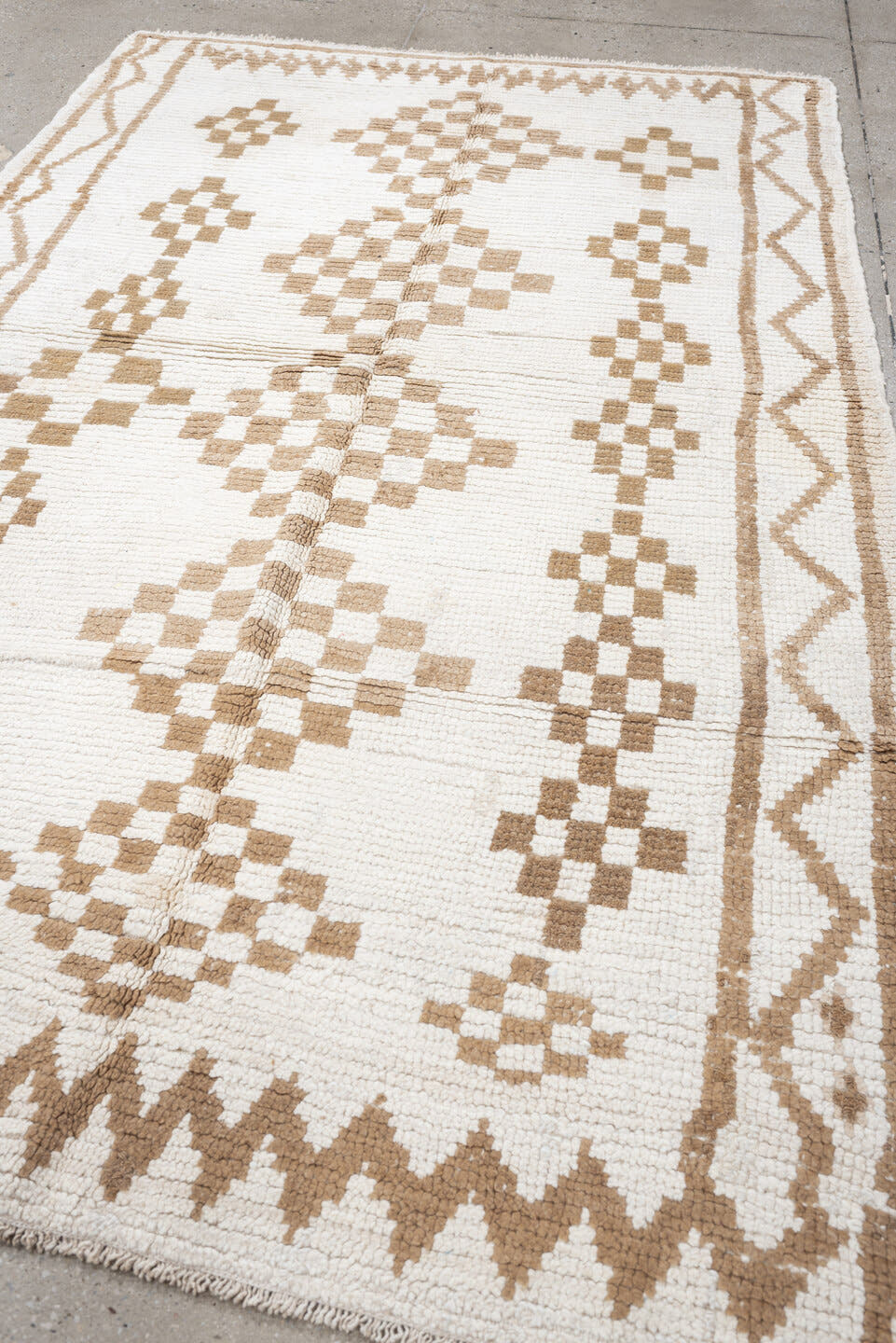 4' x 8' one-of-a-kind handmade vintage Moroccan medium size rug. Color palette: ivory, camel, cream, tan, beige