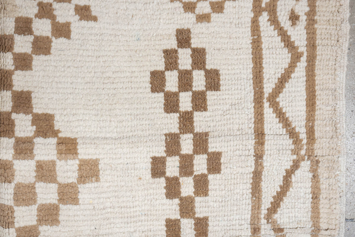 4' x 8' one-of-a-kind handmade vintage Moroccan medium size rug. Color palette: ivory, camel, cream, tan, beige
