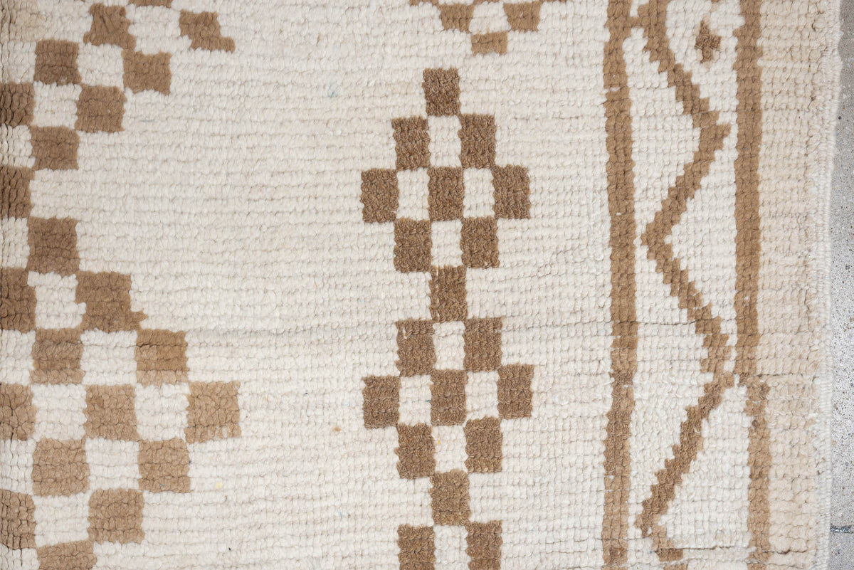 4' x 8' one-of-a-kind handmade vintage Moroccan medium size rug. Color palette: ivory, camel, cream, tan, beige
