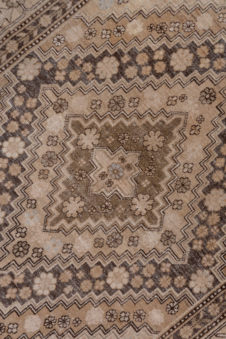 5' x 11' one-of-a-kind handmade vintage Khotan rug. Color palette: brown, gray, light gray, off-white, pink