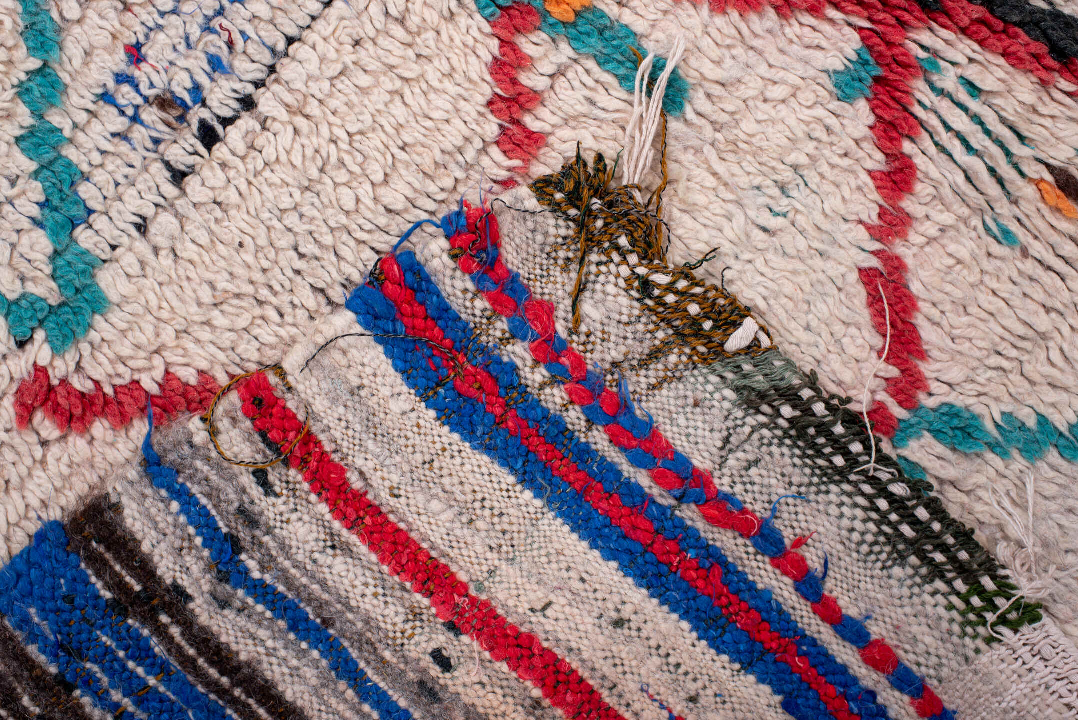 4' x 6' one-of-a-kind handmade vintage Moroccan small size rug. Color palette: ivory, turquoise, charcoal, orange, red, blue