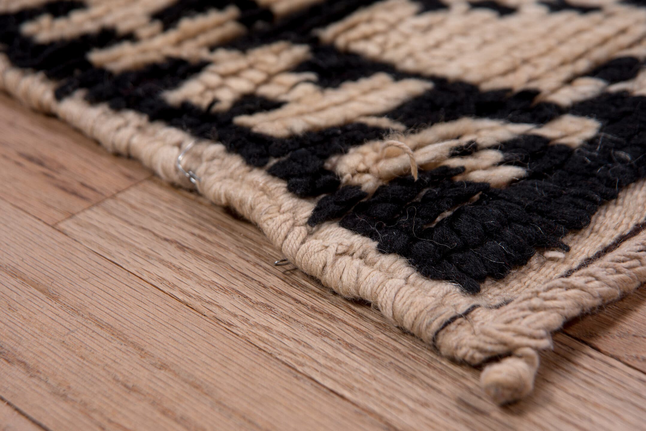 5' x 7' one-of-a-kind handmade antique Moroccan rug. Color palette: ivory, black, crimson, green, gold, rose, red, pink