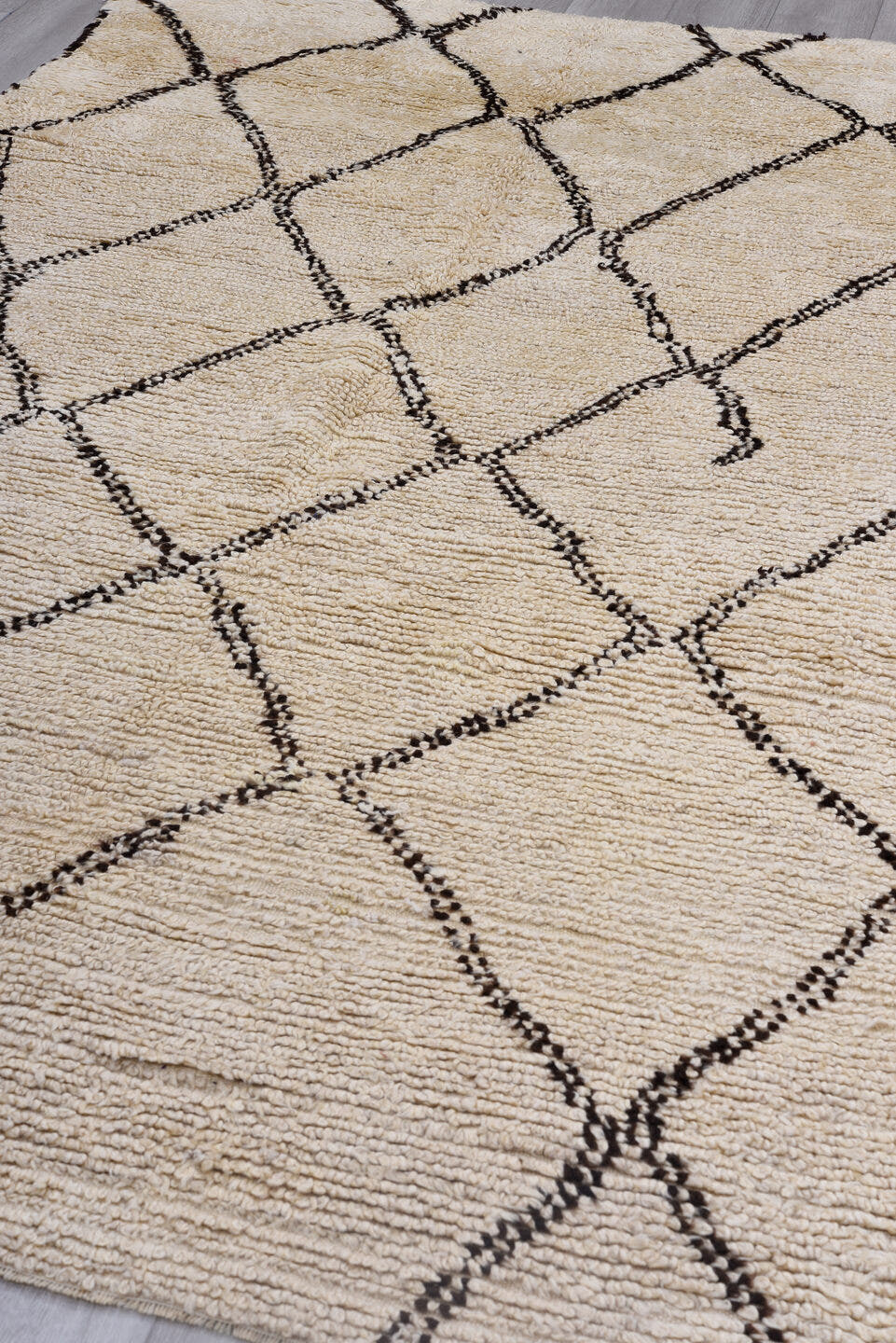 5' x 9' one-of-a-kind handmade antique Moroccan medium size rug. Color palette: ivory, brown, cream