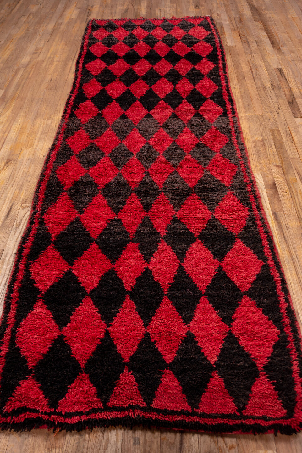 3' x 11' one-of-a-kind handmade vintage Moroccan runner rug. Color palette: crimson, charcoal, rose, red, gray, black, pink