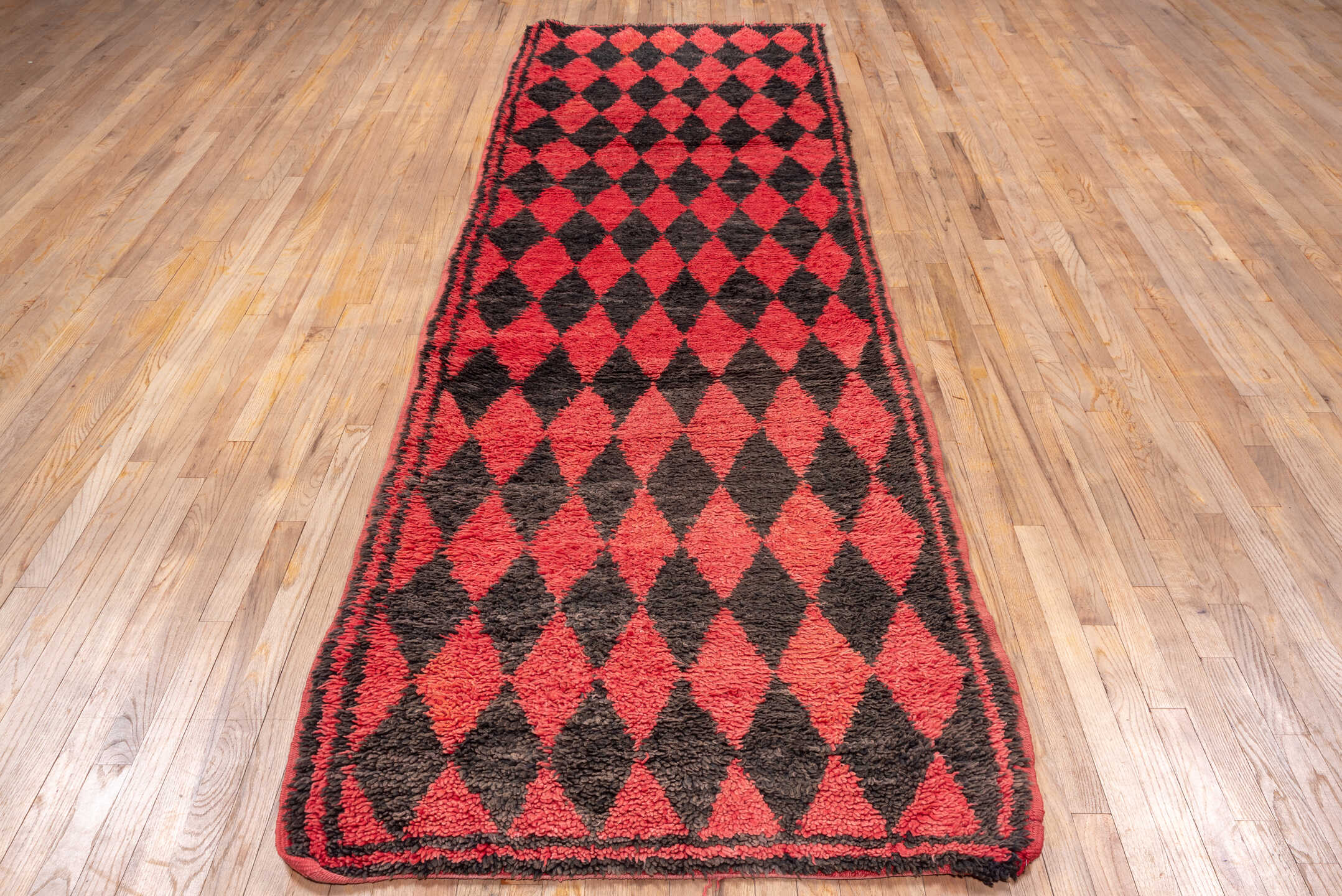 3' x 11' one-of-a-kind handmade vintage Moroccan runner rug. Color palette: crimson, charcoal, rose, red, gray, black, pink